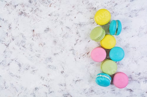 Preview: Delicious colorful macaron cakes on wooden background