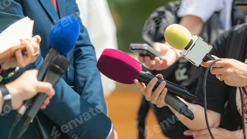 Preview: Media coverage as journalists with microphones gather at a press conference