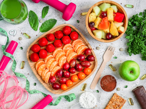 Preview: Sports breakfast with fruits and berries on a cement background.