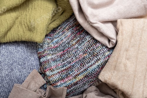 Preview: Top view of cozy knitted sweaters. Warm concept