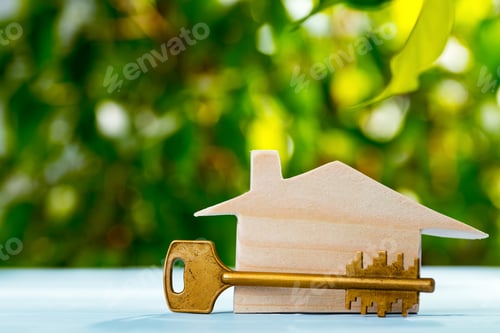 Preview: Wooden toy house and house keys close up
