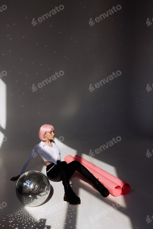 Preview: Contemporary Pink-Haired Woman in Minimalist Studio