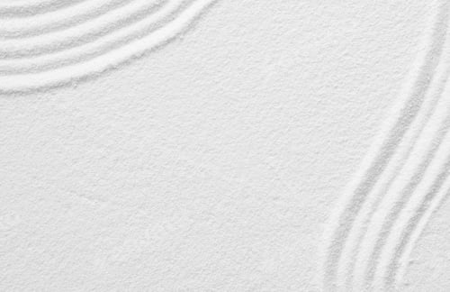 Preview: Japanese Zen Garden with concentric circles lines on white sand surface background,Sand texture