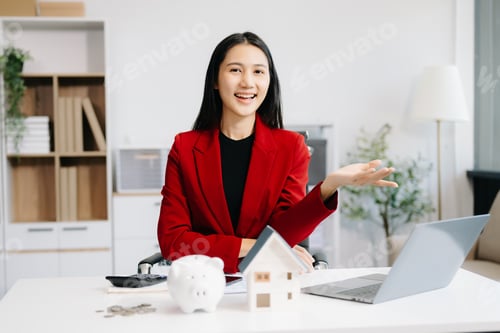 Preview: Young real estate agent worker working with laptop and tablet at table in office