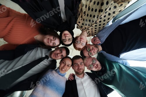 Preview: A diverse group of business professionals standing together in a powerful, united pose, captured