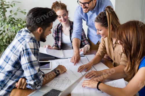 Preview: Image of business partners discussing documents and ideas