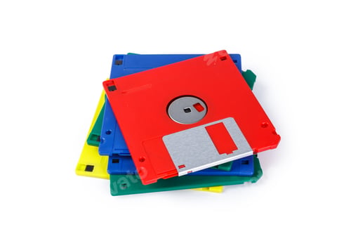 Preview: Collection of colorful floppy disks stacked on each other for tech history reference