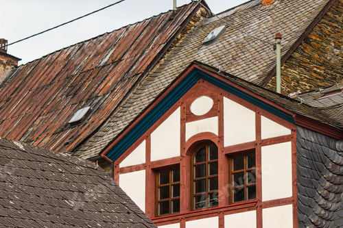Preview: Beautiful shot of white and red houses with slate rooftops