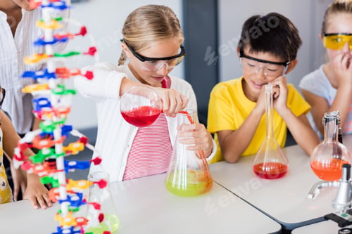 Preview: Pupil doing science while classmates looking her