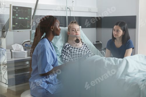 Preview: Pediatric clinic nurse analyzing little girl health condition while talking to worried mother