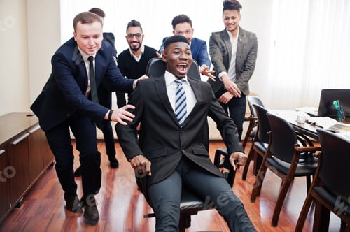 Preview: Multiracial young creative people in modern office