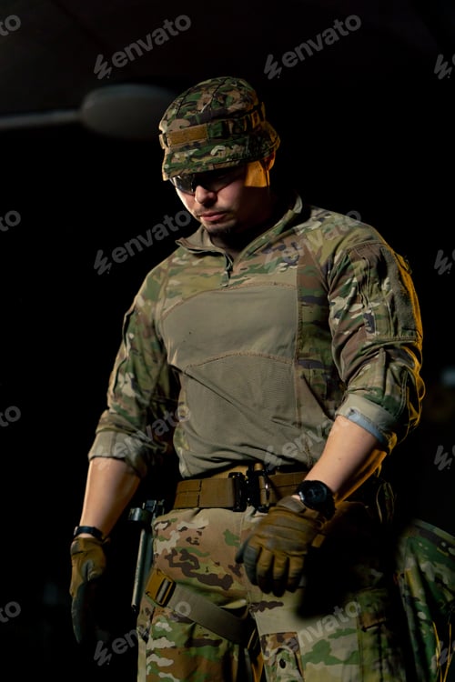Preview: close-up at a professional shooting range a military trainer reloading a pistol ready to shoot