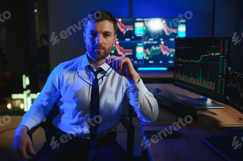 Preview: Financial Analyst. Businessman Works in Investment Bank Downtown Office at Night