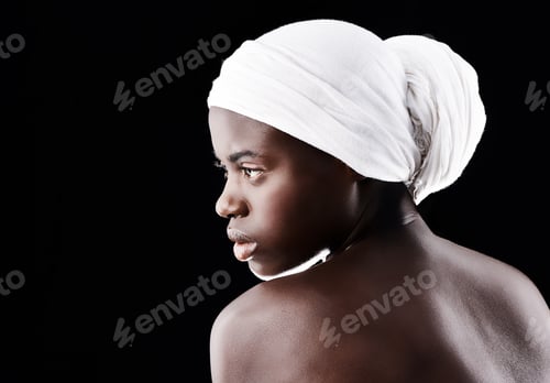 Preview: Studio shot of a beautiful woman wearing a headscarf against a black background