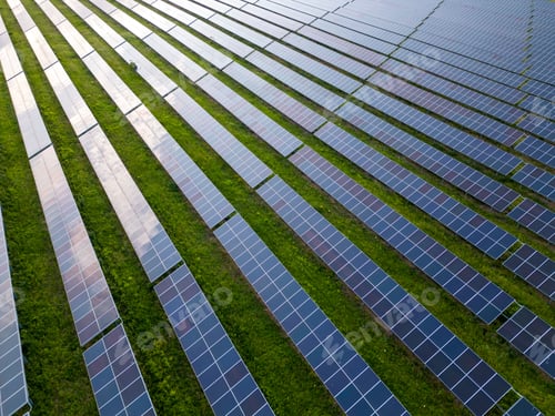 Preview: big solar power station on a green meadow aerial view