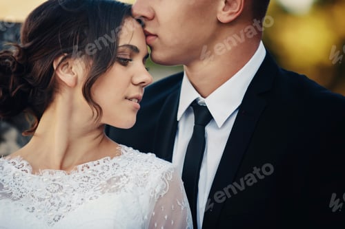 Preview: Young wedding couple enjoying romantic moments. Wedding day.