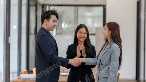 Preview: Asian business people shake hand to confirm the agreement in the business of mutual investment