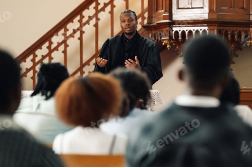 Preview: African american priest giving sermon from altar in church