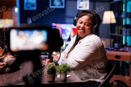 Preview: Woman using camera to record a vlog