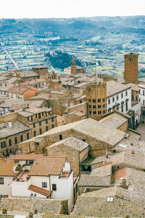 Preview: aerial view of buildings roofs and green hills in Orvieto, Rome suburb, Italy