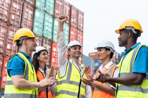 Preview: Group of young male and female worker working in container terminal.