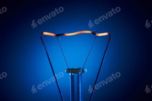 Preview: Electric bulb lamp with a spiral on a black background