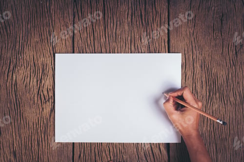 Preview: Top view Hand with blank white paper