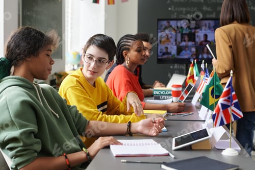 Preview: Diverse Group of Students Talking in Class