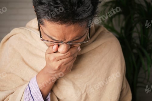 Preview: Mature man felling sick and coughs at home