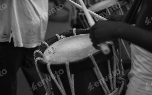 Preview: Closeup shot of a Indian men playing traditional percussion drum Chenda during a festival in Kerala