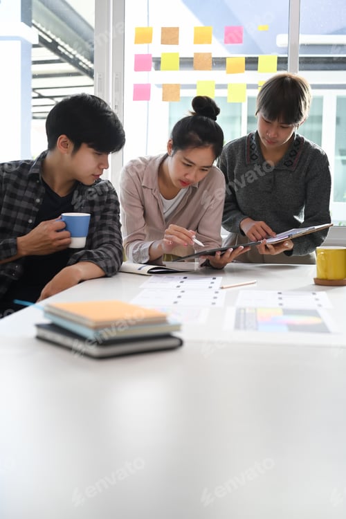Preview: Group of creative designer at the meeting table for discussing the important issues.