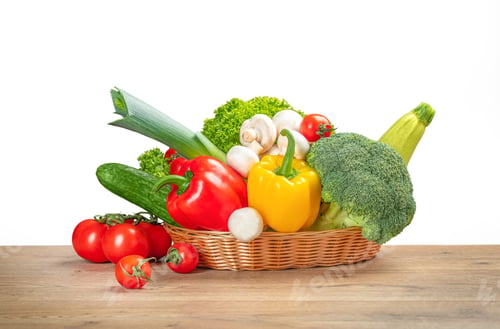 Preview: Basket with fresh vegetables and mushrooms on wooden table isolated on white,