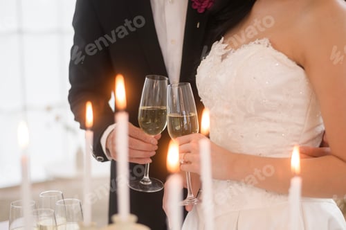 Preview: Newlyweds Toasting Champagne at Wedding Reception
