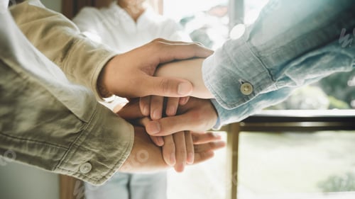 Preview: Group of corporate colleagues united, joining or working together.