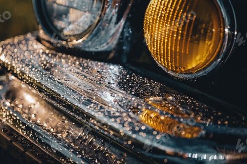 Preview: Closeup of car bumper with rain drops