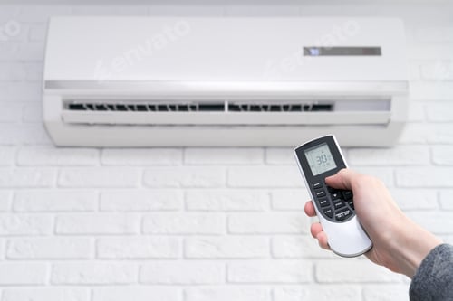 Preview: home air conditioner and hand with remote control