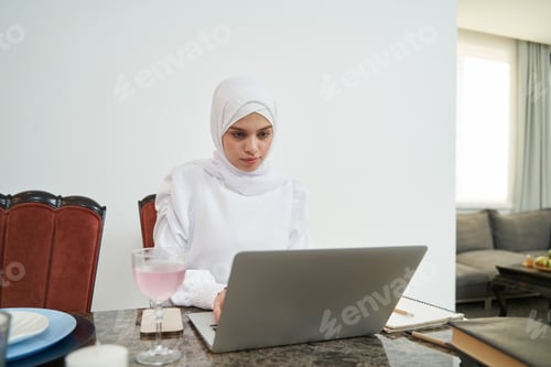 Preview: Woman Working on Laptop at Home Office
