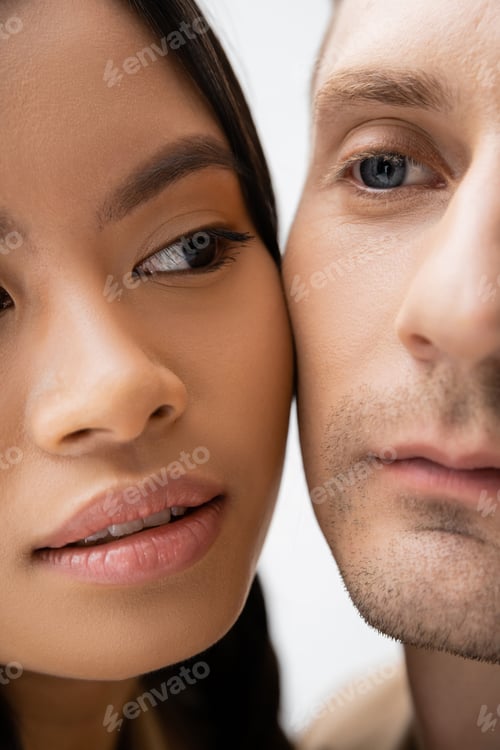 Preview: close up view of cropped interracial couple isolated on white