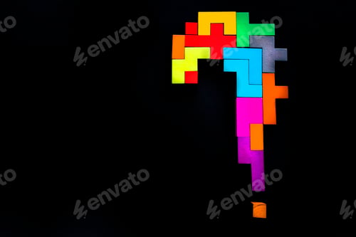 Preview: question mark wooden blocks on black background. Geometric shapes in different colors.