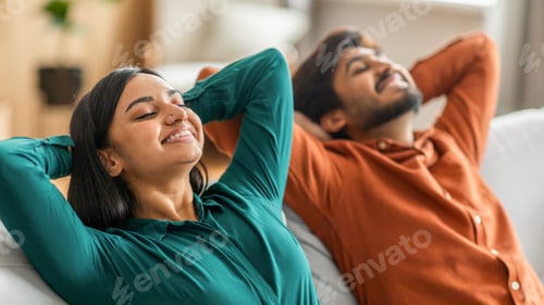 Preview: A Man and a Woman Laying on a Couch