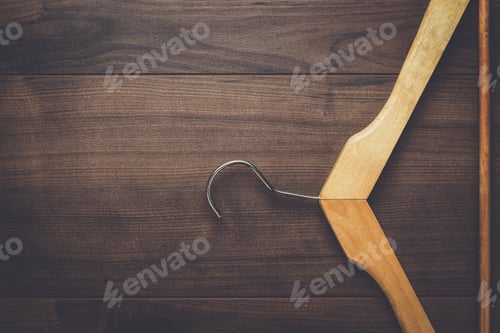 Preview: Wooden Hanger on Brown Wooden Background
