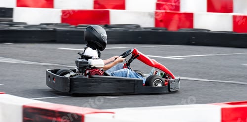 Preview: Kid Driving Fast Go Kart By Racing Track