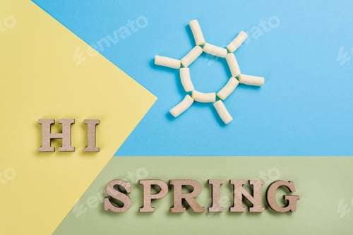 Preview: Hi spring, abstract image with wooden letters on the background of the sun and blue yellow green.