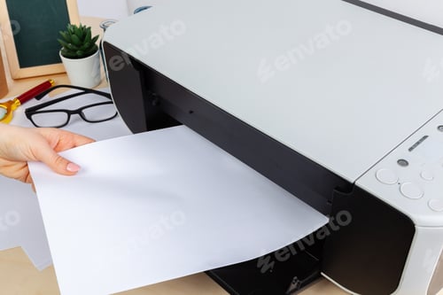 Preview: Hands of a woman using a copying machine close up