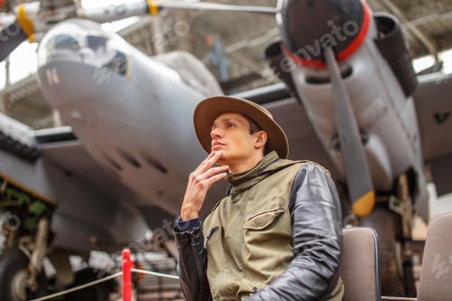 Preview: Man in hat on airplanes exhebition.