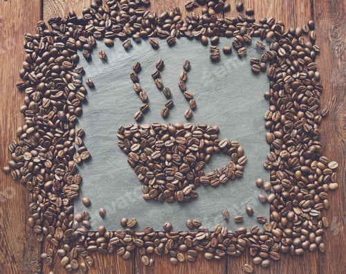 Preview: Cup from coffee beans at stone background