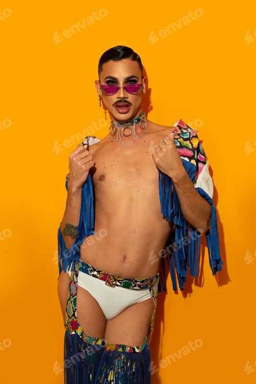 Preview: beautiful drag queen in colorful dress on yellow background