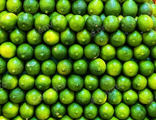 Preview: Fresh organic green limes on display at the local market!