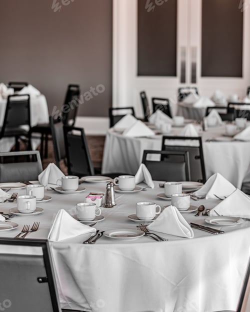 Preview: Vertical shot of neat tables in a nice, empty and clean restaurant