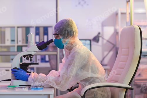 Preview: Medical worker using microscope at work